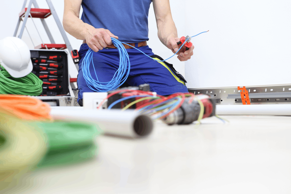 Electrician rewiring cables