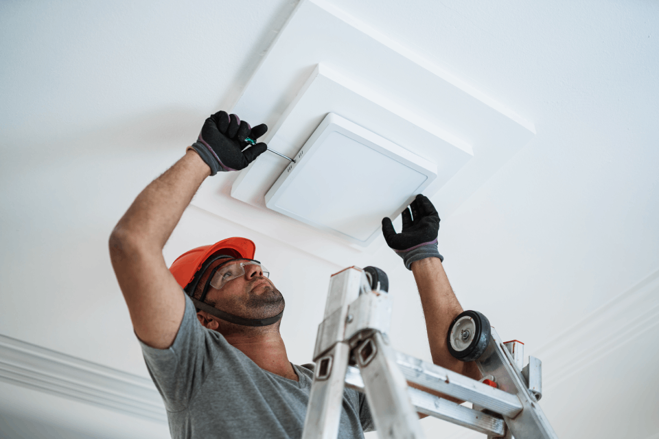 Electrician installing lightings