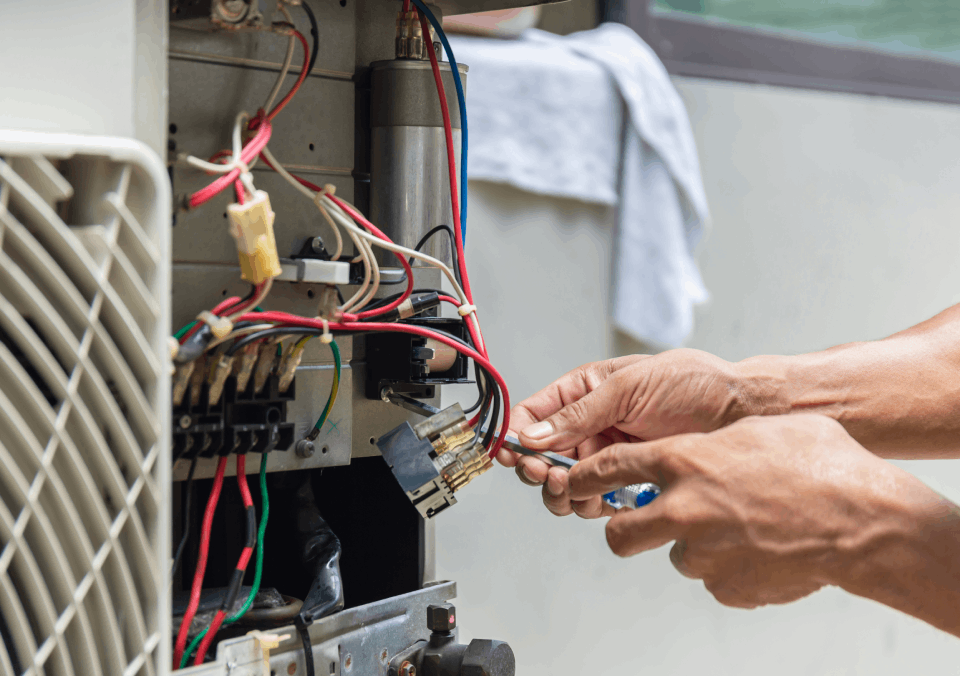 Worker performing contactor repair